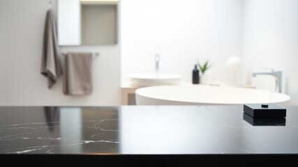 Fototapeta premium Sleek Black Countertop in a Modern Bathroom with a White Tub and a Single Towel Hanging