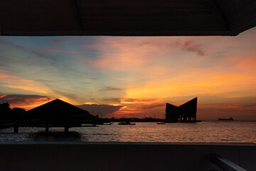Seaside pavilion and golden sunlight