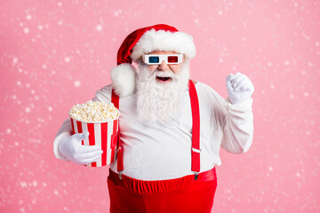Portrait of his he nice attractive cheerful cheery glad bearded fat Santa watching comedy film...