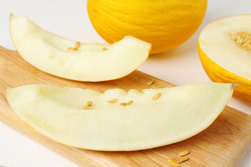 Fresh ripe melons on white table, closeup