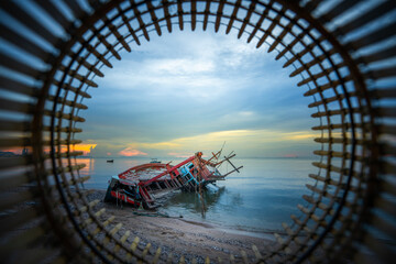 Broken fishing boat by the sea