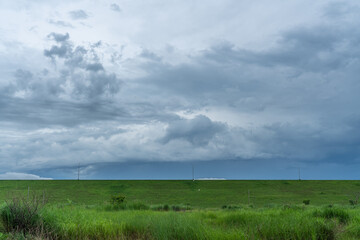 gray skies and green fields