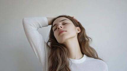 Naklejka premium Employee at a desk, tilting their head to one side, hand pressed against neck, indicating office syndrome discomfort on a white background.
