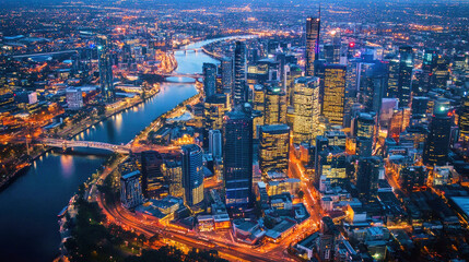 Fototapeta premium Vibrant cityscape at night featuring illuminated bridges and a winding river through the skyline