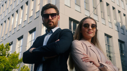 Caucasian two coworkers colleagues businessman business male guy man with businesswoman girl female...