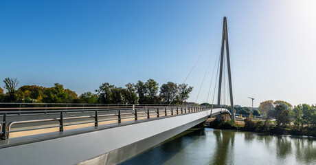 Obraz premium The Robert Poujade footbridge connecting the island of Ramier and crossing the Garonne in Toulouse, Haute Garonne, Occitanie, in France