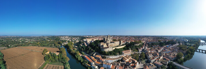 Panoramic of the old bridge and the Saint-Nazaire cathedral on the Orb in Béziers, Occitanie, France