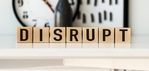 DISRUPT word on wooden cubes on a light background