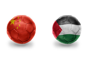 football balls with national flags of palestine and china ,soccer teams. on the white background.