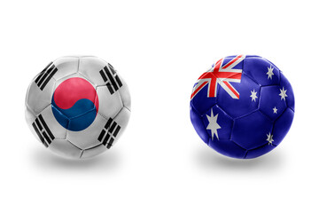Obraz premium football balls with national flags of australia and south korea ,soccer teams. on the white background.