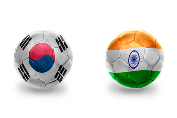 Obraz premium football balls with national flags of india and south korea ,soccer teams. on the white background.