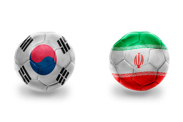 football balls with national flags of iran and south korea ,soccer teams. on the white background.