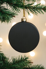 Hockey Puck Themed Christmas Ornament Mockup Template with Blank Puck Hanging from a Christmas Tree