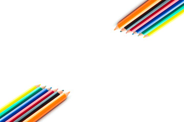 Fototapeta premium Colored pencils isolated on white background. Wooden color pencils arranged in bulk. Back to school idea concept