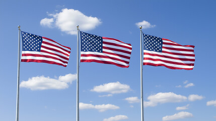 Obraz premium Three American Flags Waving in the Breeze Against a Clear Sky