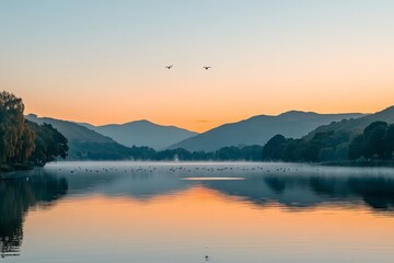 Fototapeta premium Serene lake at sunrise with gentle waves and mist. Mountains fade softly in the background. A calm, tranquil moment captured perfectly. Generative AI