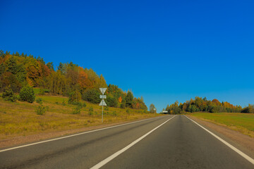 Autumn landscape, road and highway, asphalt and roadside.