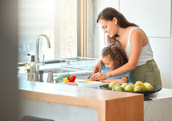 Woman, child and teaching to cook with smile, help and guidance for support in kitchen. Mother,...