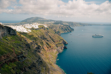 Fototapeta premium Early morning view of bay on Santorini island, Greece. the luxury cruise ships in the bay