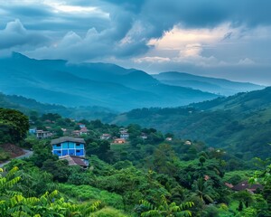 A mountain range with a blue house in the middle. The house is surrounded by trees and the mountains are covered in green foliage. The sky is cloudy, but the sun is shining through the clouds
