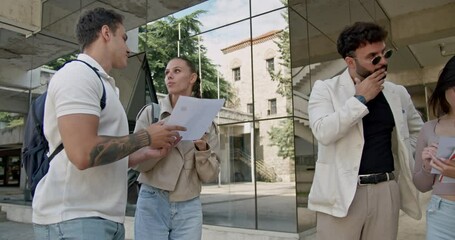 High school students consult with their professor about a school science contest after classes. They discuss tasks and prepare for the competition.