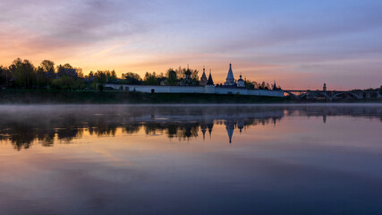 Naklejka premium Staritsky Assumption Monastery early in the morning at dawn