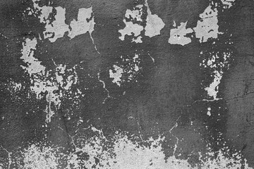 Peeling paint and cracked gray wall texture background. Weathered decayed urban surface with...