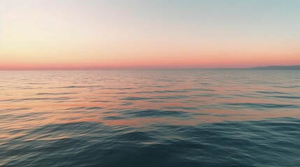 Obraz premium Golden Hour Serenity: A breathtaking panoramic view of a calm ocean at sunrise, bathed in soft, golden light. 