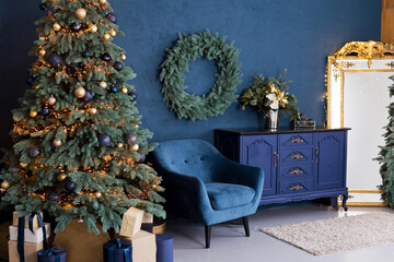 Christmas interior with blue armchair