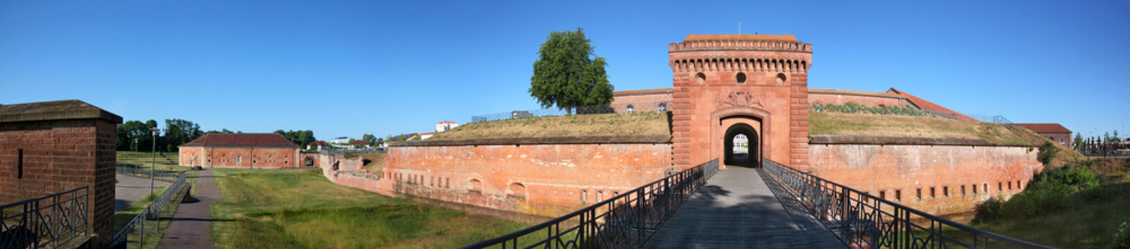 Panoramic view of the fortress with moat and red sandstone gate Wei&szlig;enburger Tor in the old town of Germersheim in Germany
