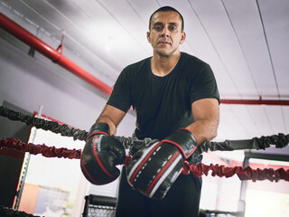 Boxing ring, confidence and portrait of man in gym with pride, power or fitness challenge in sports...
