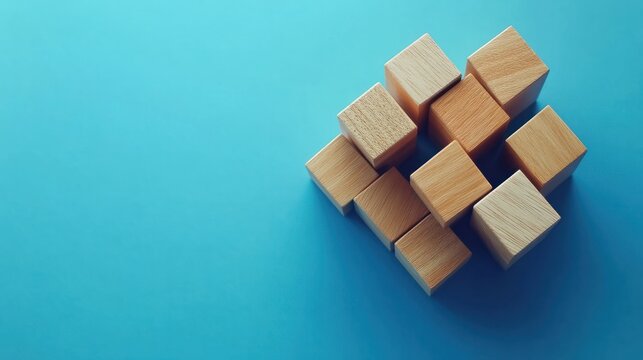 Wooden blocks connected together on a blue background. Teamwork concept