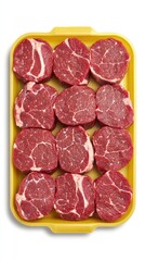 Fototapeta premium Sliced raw chicken meat arranged neatly in a yellow plastic tray on a pristine white background showcasing culinary presentation