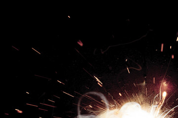 A bright flash of light and a sheaf of sparks in a cloud of smoke. Miniature Universe. Design...
