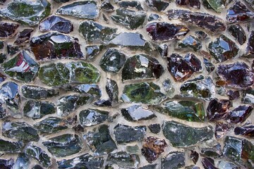 Glass fiber melt multicolored blocks cemented on facade concrete wall as modern architectural...