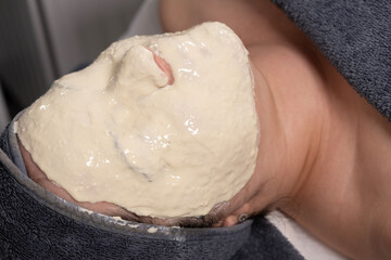 Woman getting a mask for skin care