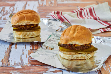 venison burger sliders with ketchup, mustard, and pickles