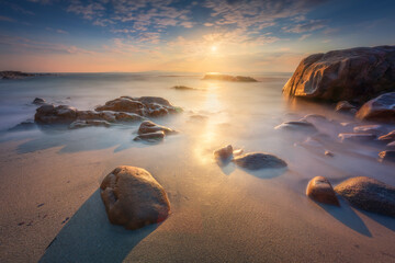 Rocks in Cala Violina beach in Maremma at sunset, Tuscany. Mediterranean sea. Italy.
