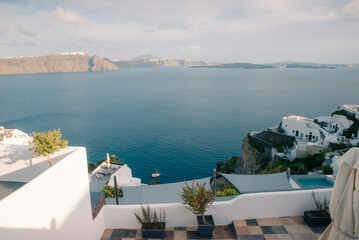 Obraz premium Fira town by the sea on mountain coast of Santorini island in Greece - 2 may 2024