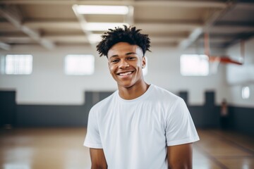 Obraz premium Smiling portrait of a teenage male African American basketball player