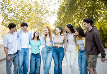 A group of 8 young people between 18 and 25 years old of different ethnicities have fun one day in...