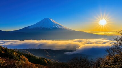 Fototapeta premium A breathtaking view of Mount Fuji at sunrise above a sea of clouds.