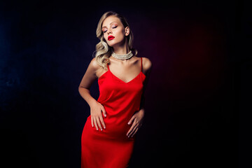 Naklejka premium Photo of stunning passionate hollywod lady posing trendy red dress isolated on dark color background