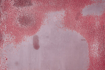 Fragment of a rusty grunge surface. Dark red background color. Scuffs and peeling of old paint....