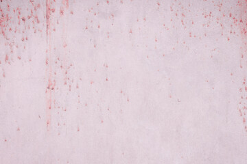 Fragment of a rusty grunge surface. Dark red background color. Scuffs and peeling of old paint....