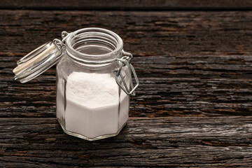 Sodium bicarbonate - Crystalline solid compound in the glass jar.