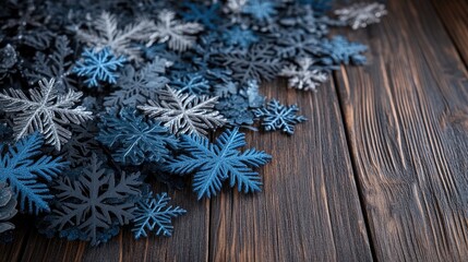 Fototapeta premium The aqua blue snowflake and silver star create a charming holiday decoration against a rustic wooden backdrop.