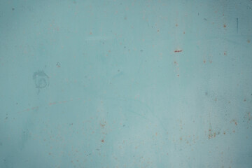Fragment of a rusty grunge surface. Green-brown background color. Scuffs and peeling of old paint....