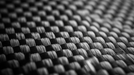 Obraz premium Close-up of Black and White Interwoven Carbon Fiber Fabric