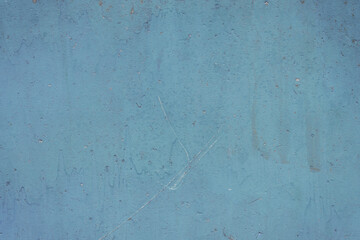 Fragment of a rusty grunge surface. Blue-brown background color. Scuffs and peeling of old paint....